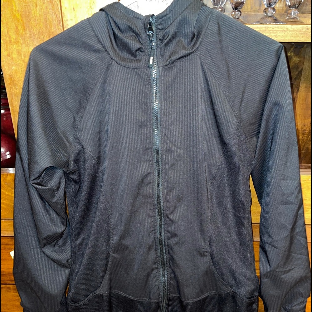Black slicky running jacket.